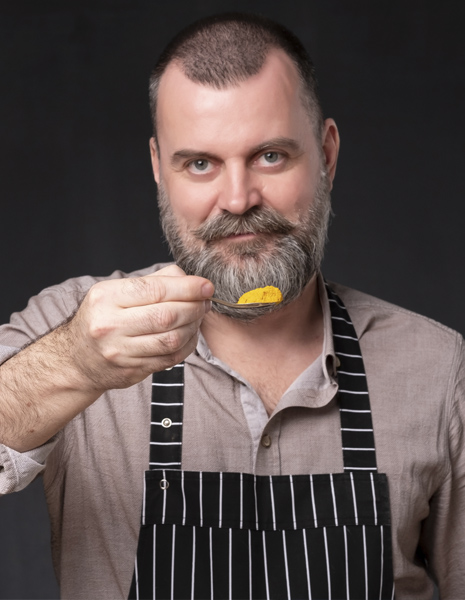 Chef with Spoon Full of Turmeric