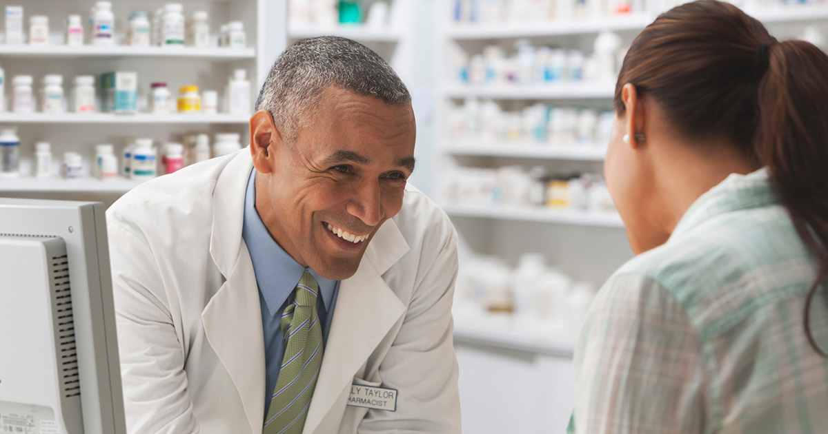 woman visiting specialty pharmacy